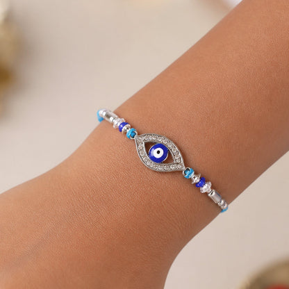 Evil Eye Rakhi with Studded Charm – Blue Crystal Beads