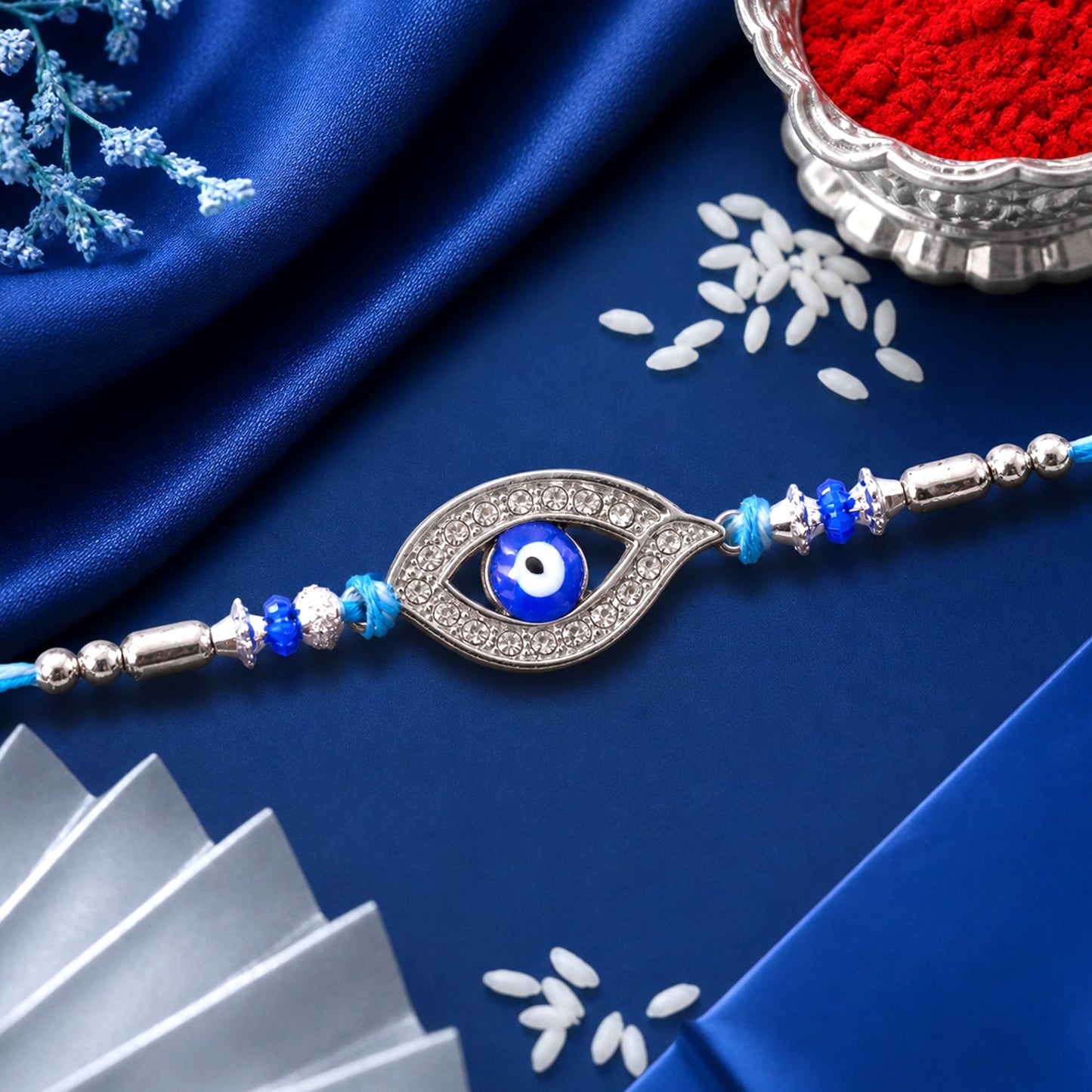 Evil Eye Rakhi with Studded Charm – Blue Crystal Beads