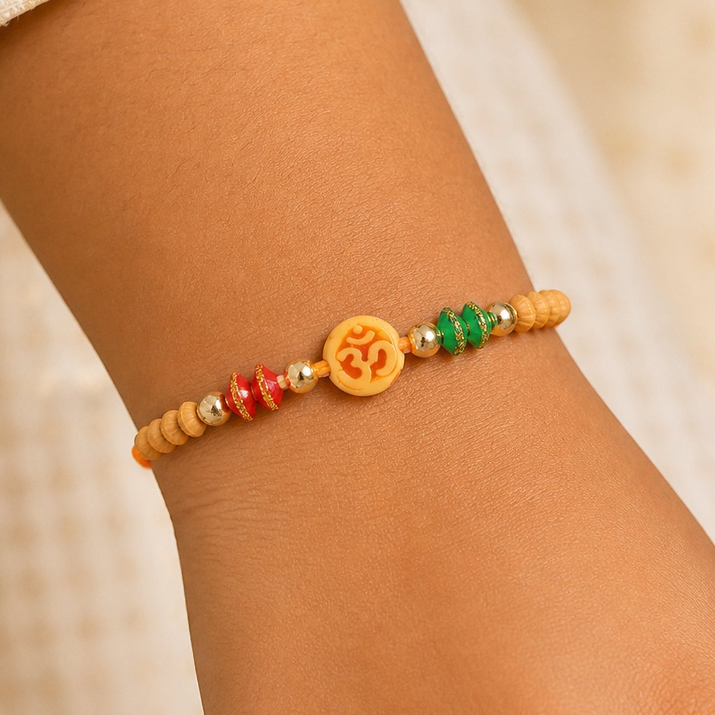 Om Motif Rakhi with Sandalwood Beads & Bead Accents