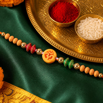 Om Motif Rakhi with Sandalwood Beads & Bead Accents