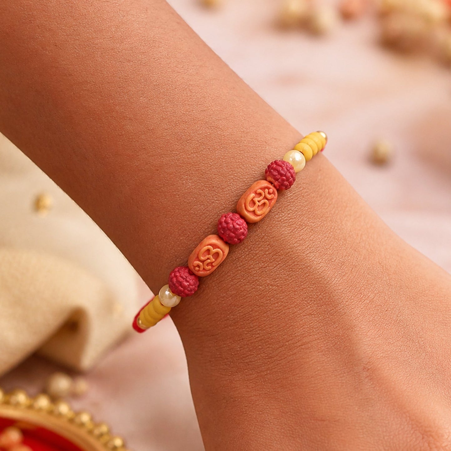 Stylish Om Charm Rudraksha Rakhi with Pearl & Sandalwood Beads