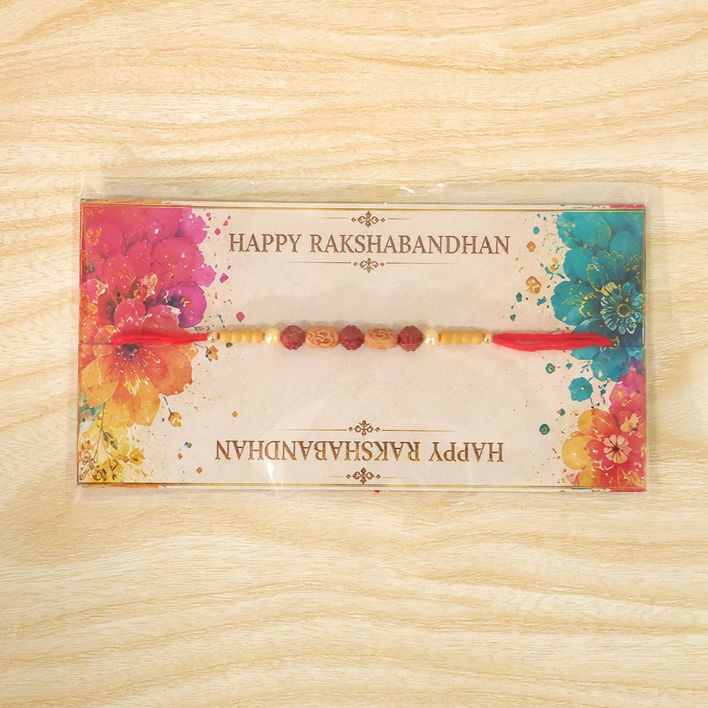 Stylish Om Charm Rudraksha Rakhi with Pearl & Sandalwood Beads