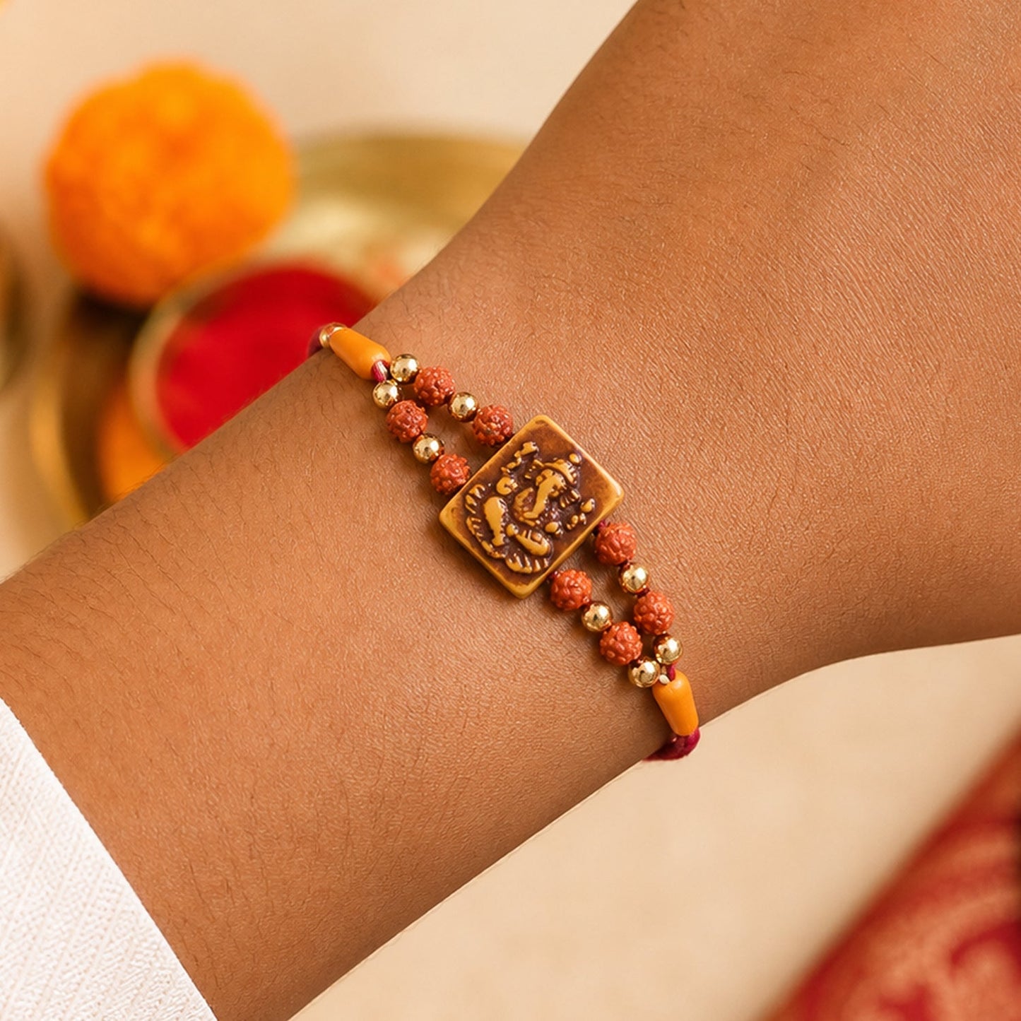 Ganesha Rudraksha Rakhi with Golden Beads – Traditional Rakhi