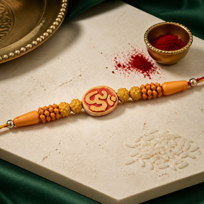 Divine Om Designer Rakhi with Golden Beads for Brother