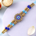 Round Evil Eye Kundan Rakhi with Pearl Beads and Ornate Center Design