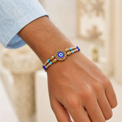Round Evil Eye Kundan Rakhi with Pearl Beads and Ornate Center Design
