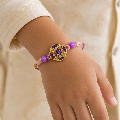 Round Evil Eye Mandala Stone Rakhi with Pearl Beads and Festive Center Charm