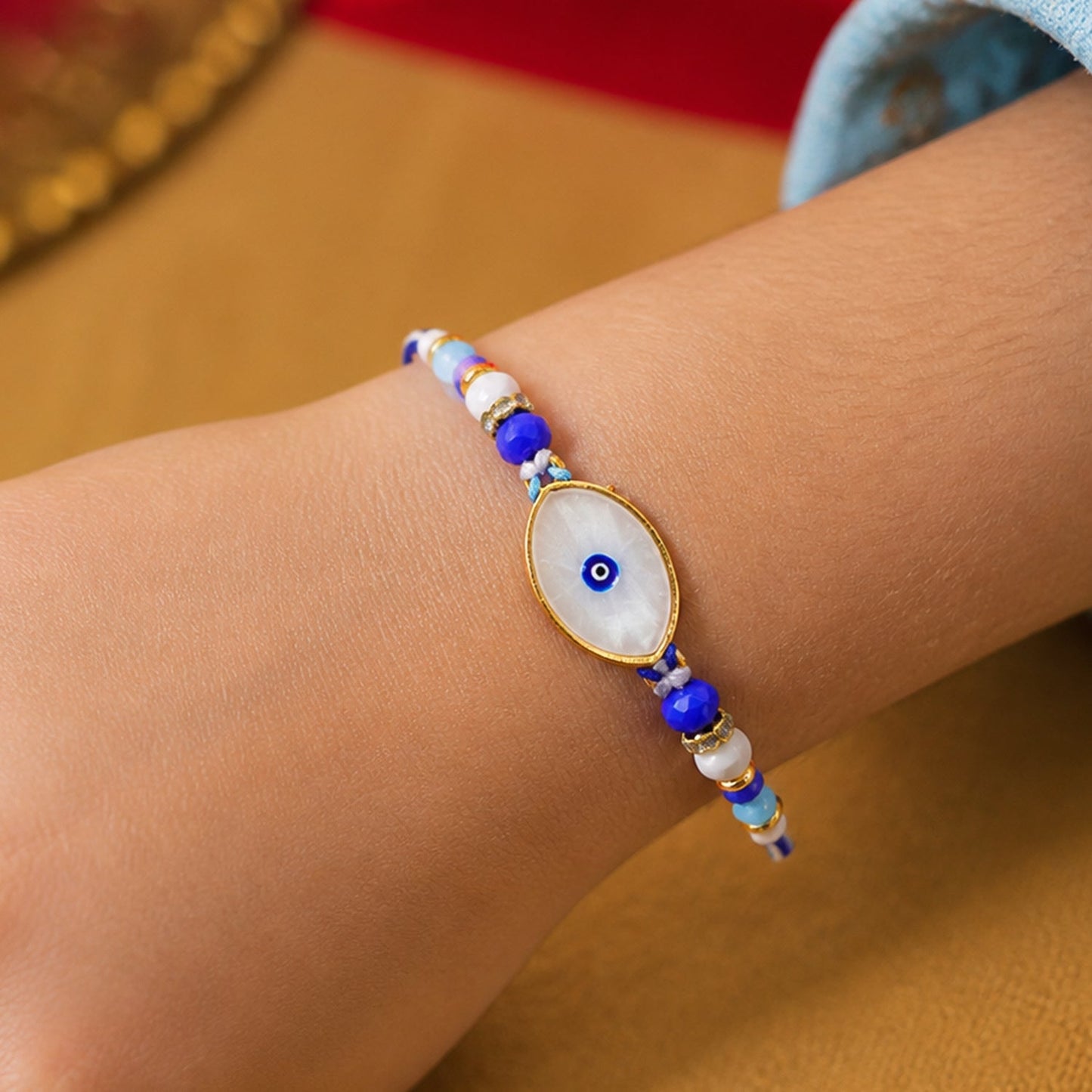 Oval Evil Eye Beaded Rakhi with Pearl Accent and Minimal Center Detail