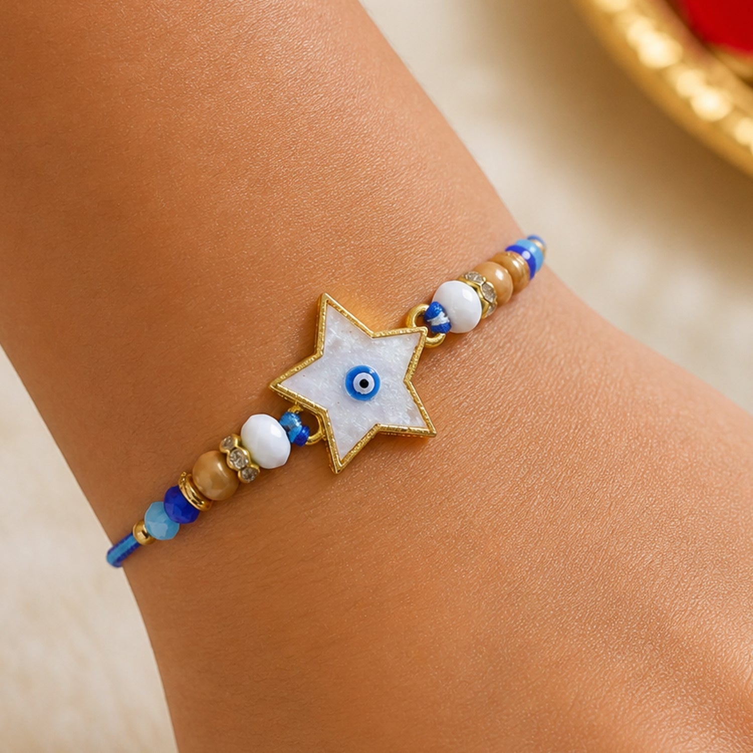 Star Evil Eye Rakhi with Pearl Beads and Cute Center Charm Design