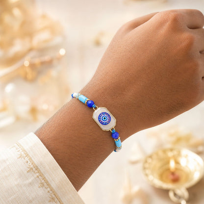 Round Nazar Stone Rakhi with Beaded String and Traditional Center Detail