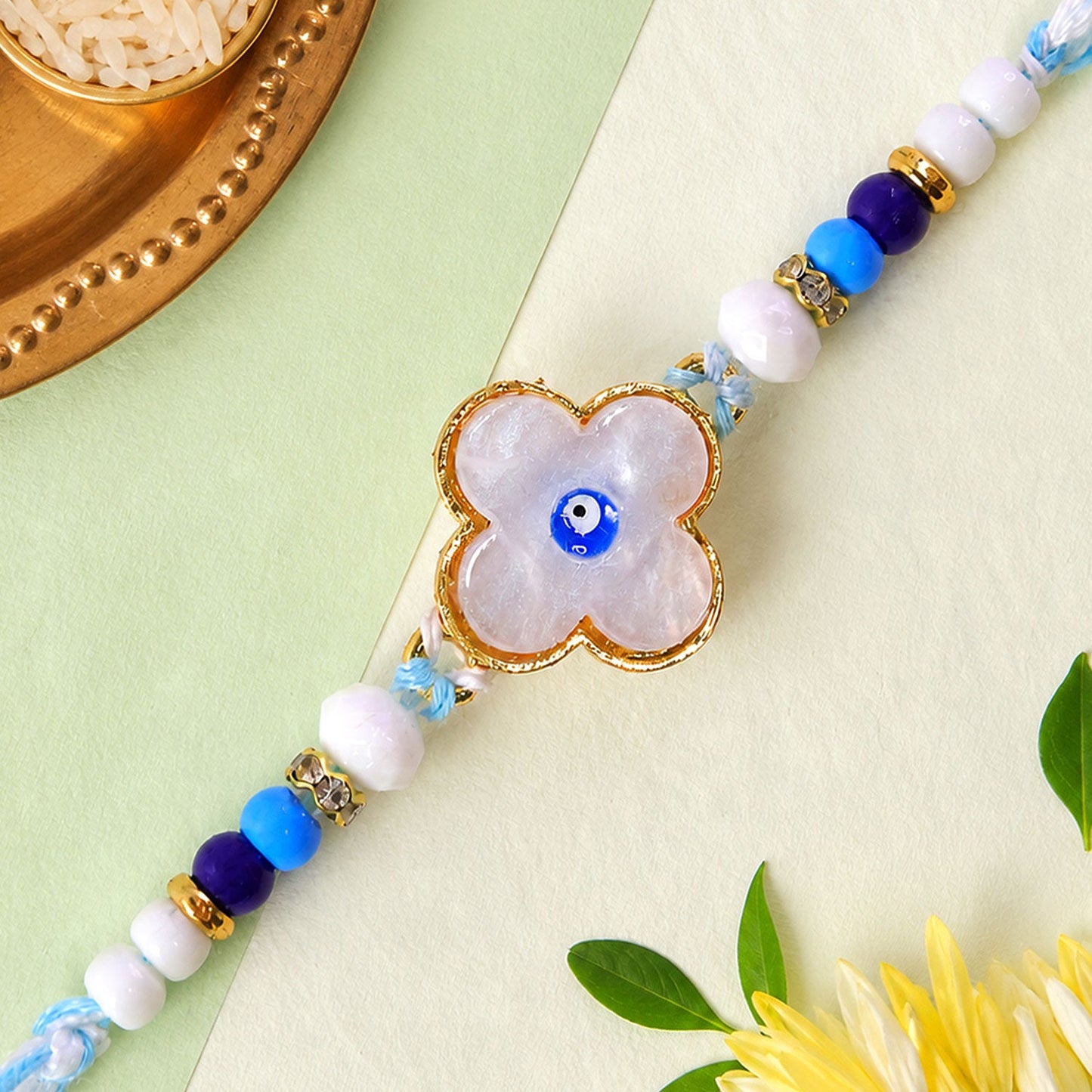 Flower Evil Eye Rakhi with Pearl Beads and Soft Petal Center Design