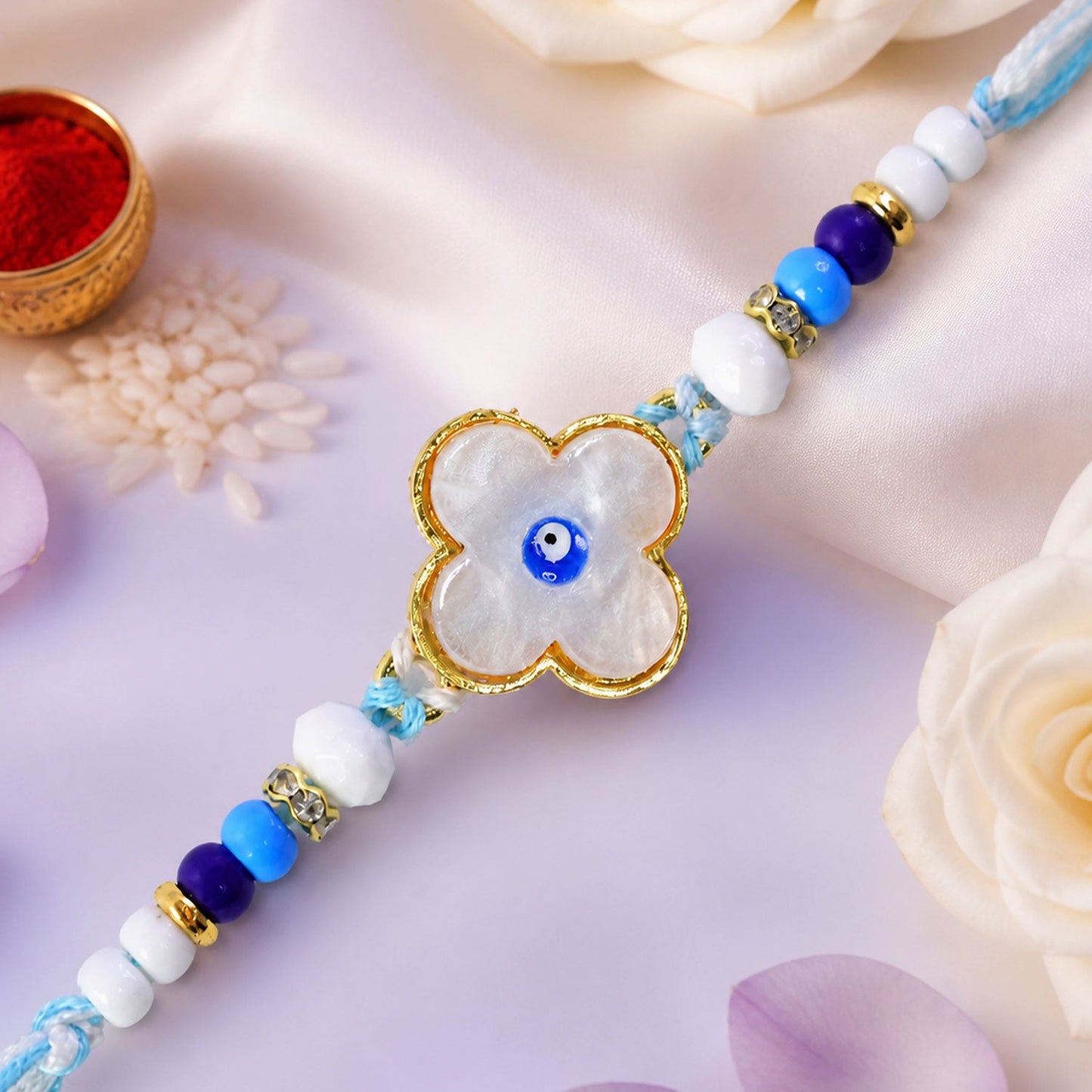 Flower Evil Eye Rakhi with Pearl Beads and Soft Petal Center Design