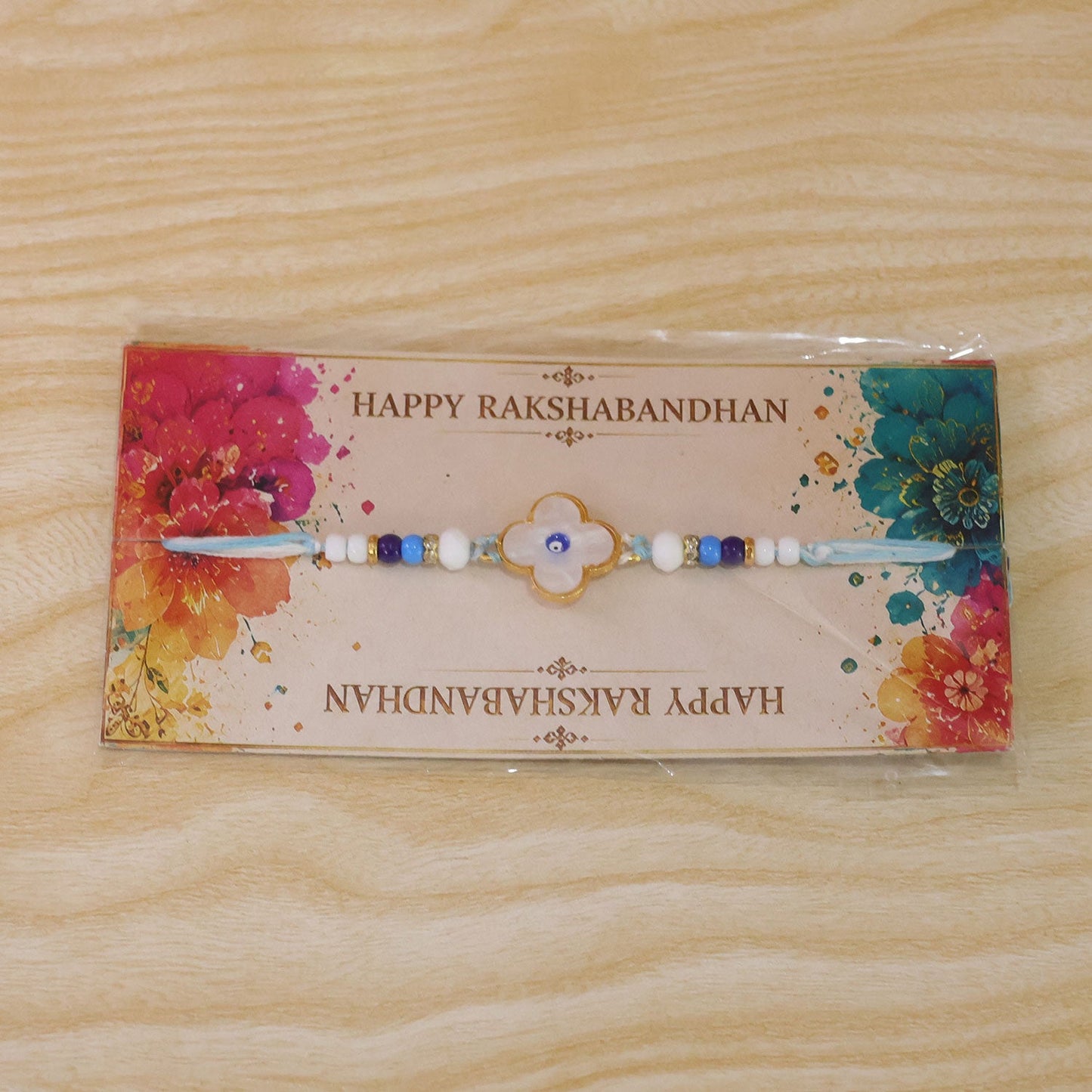 Flower Evil Eye Rakhi with Pearl Beads and Soft Petal Center Design