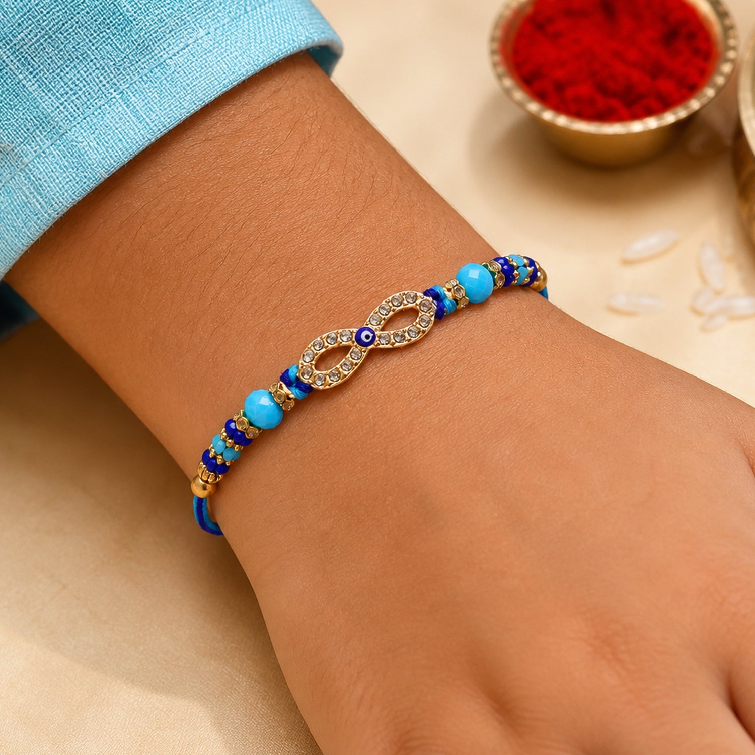 Infinity Evil Eye Stone Beaded Rakhi with Elegant Link Center Detail Design