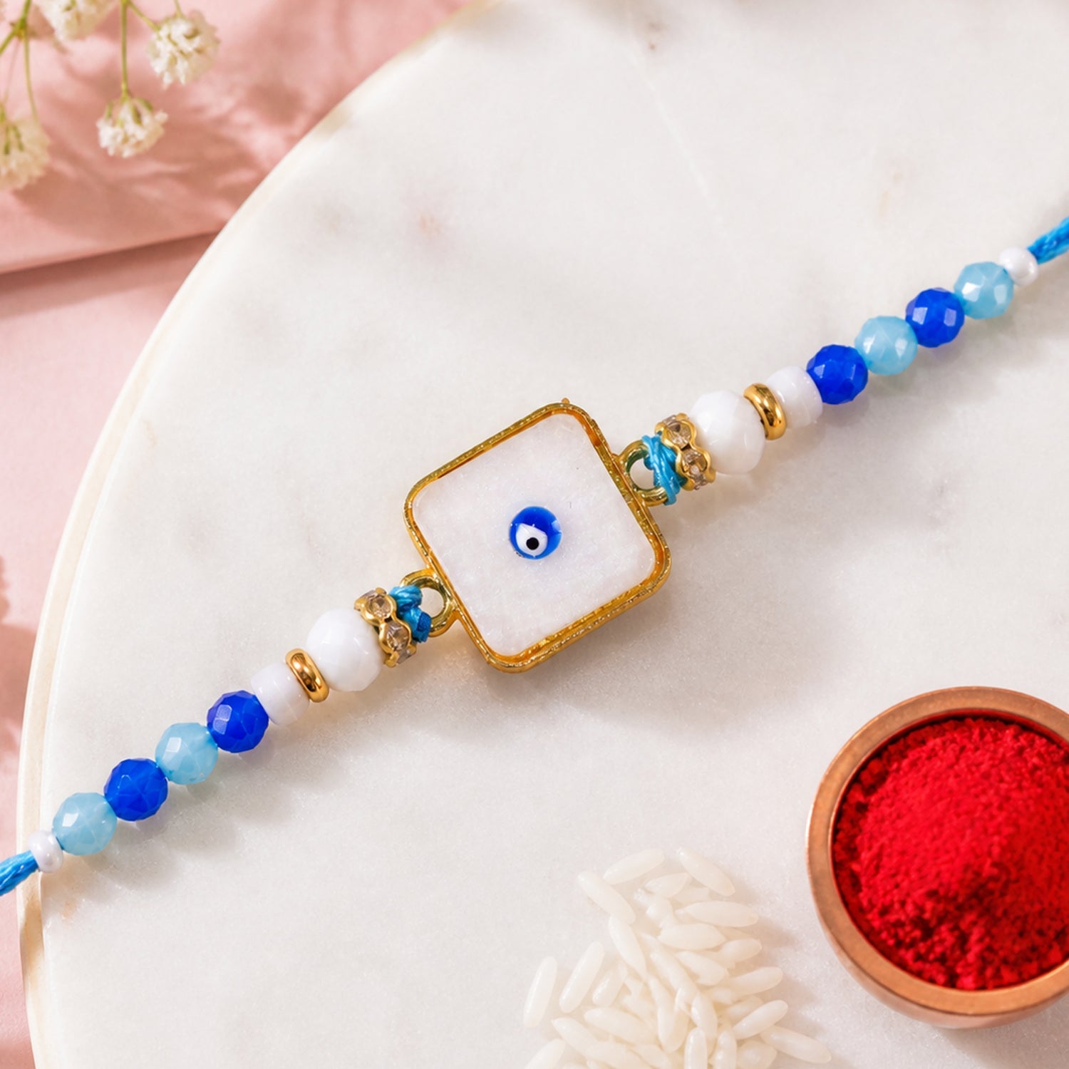 Square Evil Eye Rakhi with Pearl Beads and Simple Center Charm Design