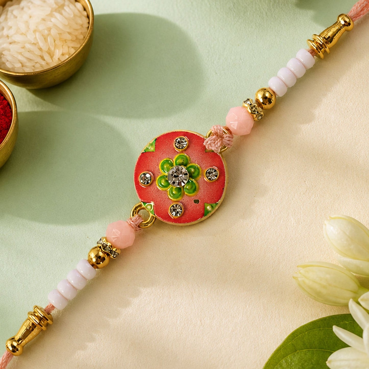 Floral Stone Beaded Rakhi with Pearl Accent and Round Center Design