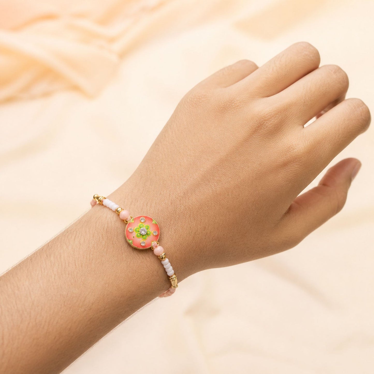 Floral Stone Beaded Rakhi with Pearl Accent and Round Center Design