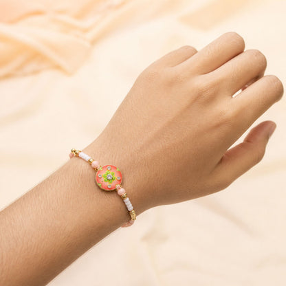 Floral Stone Beaded Rakhi with Pearl Accent and Round Center Design