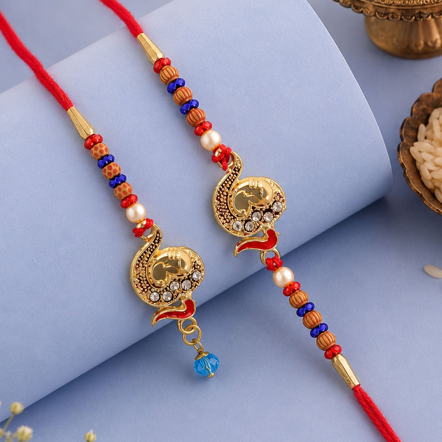 Premium Om Motif Bhai Bhabhi Lumba Rakhi with Hanging Beads