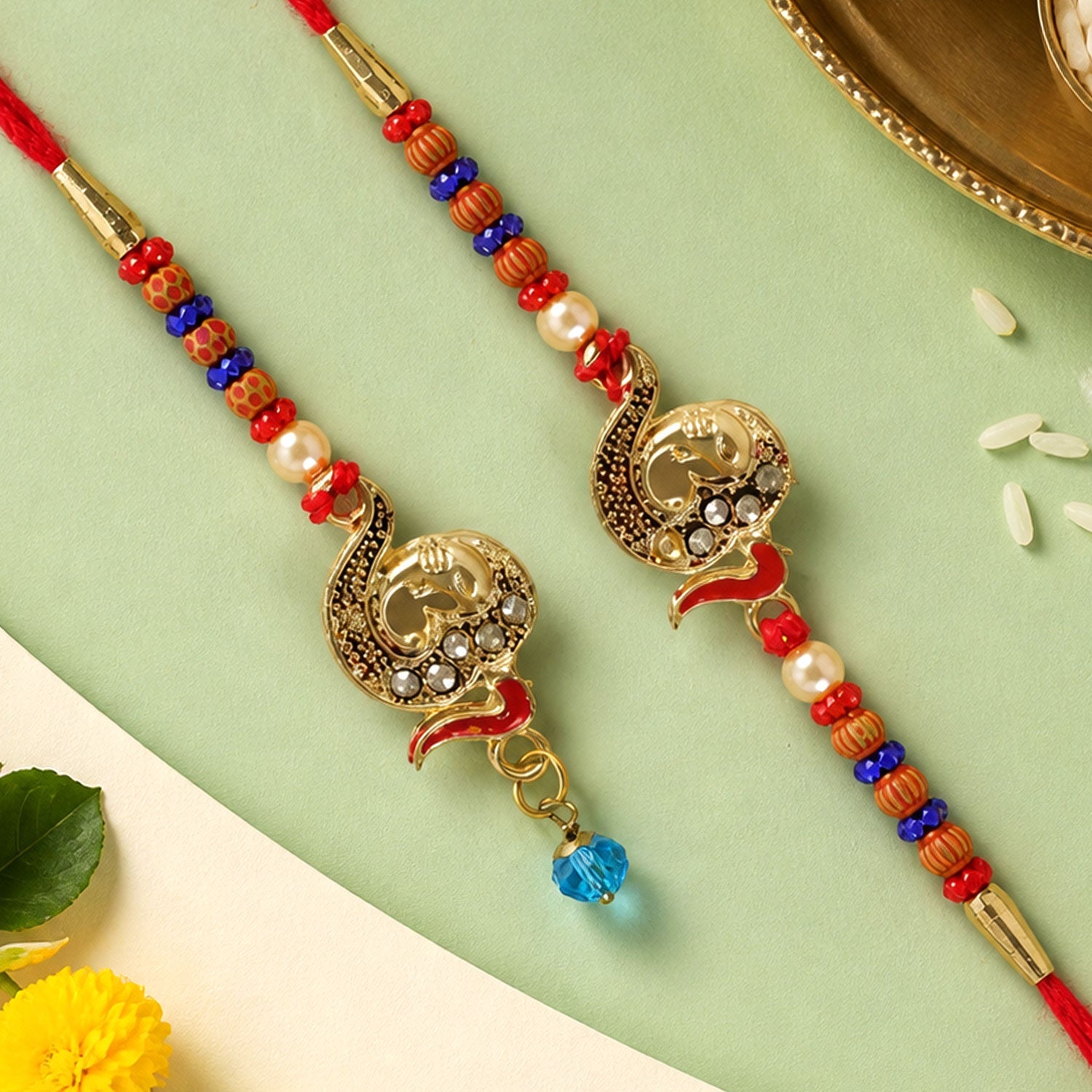 Premium Om Motif Bhai Bhabhi Lumba Rakhi with Hanging Beads