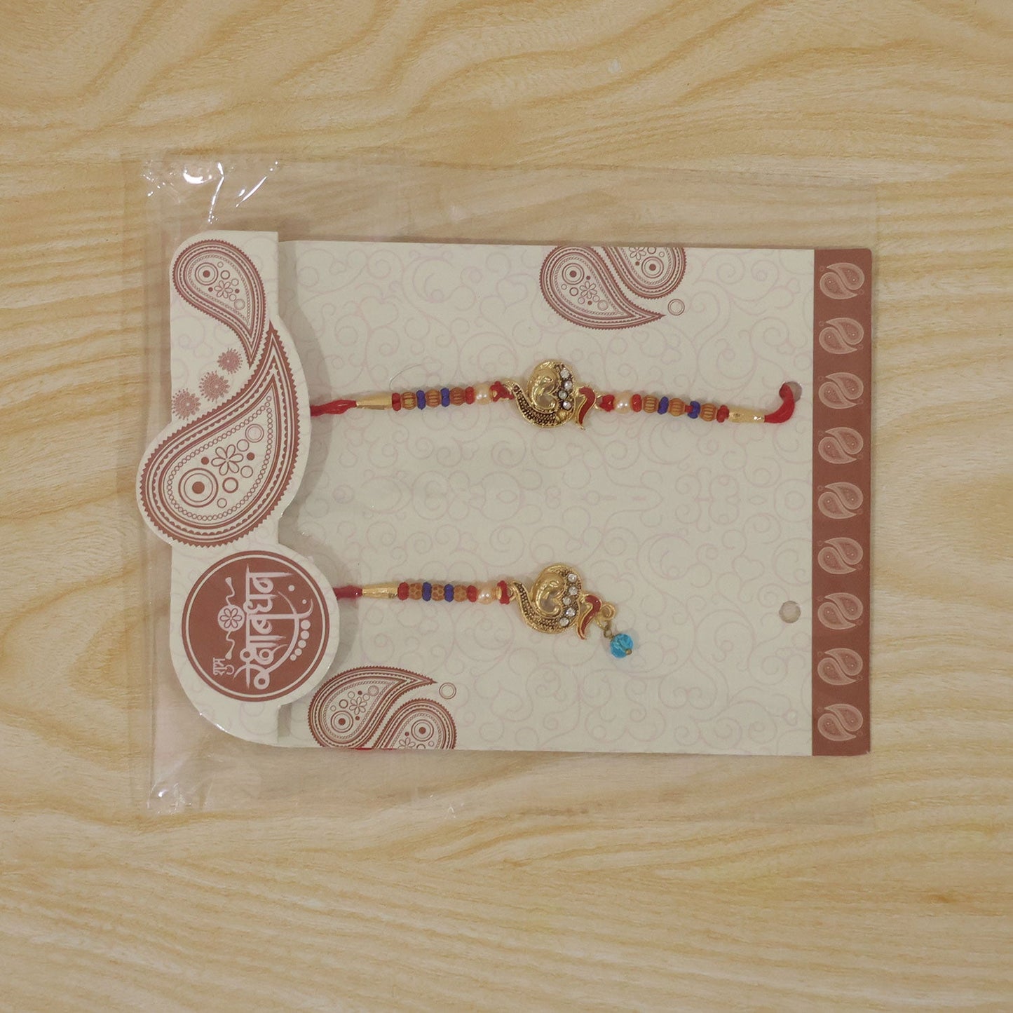 Premium Om Motif Bhai Bhabhi Lumba Rakhi with Hanging Beads
