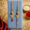 Premium Paisley Peacock Charm Bhai Bhabhi Lumba Rakhi with Pearl Drop