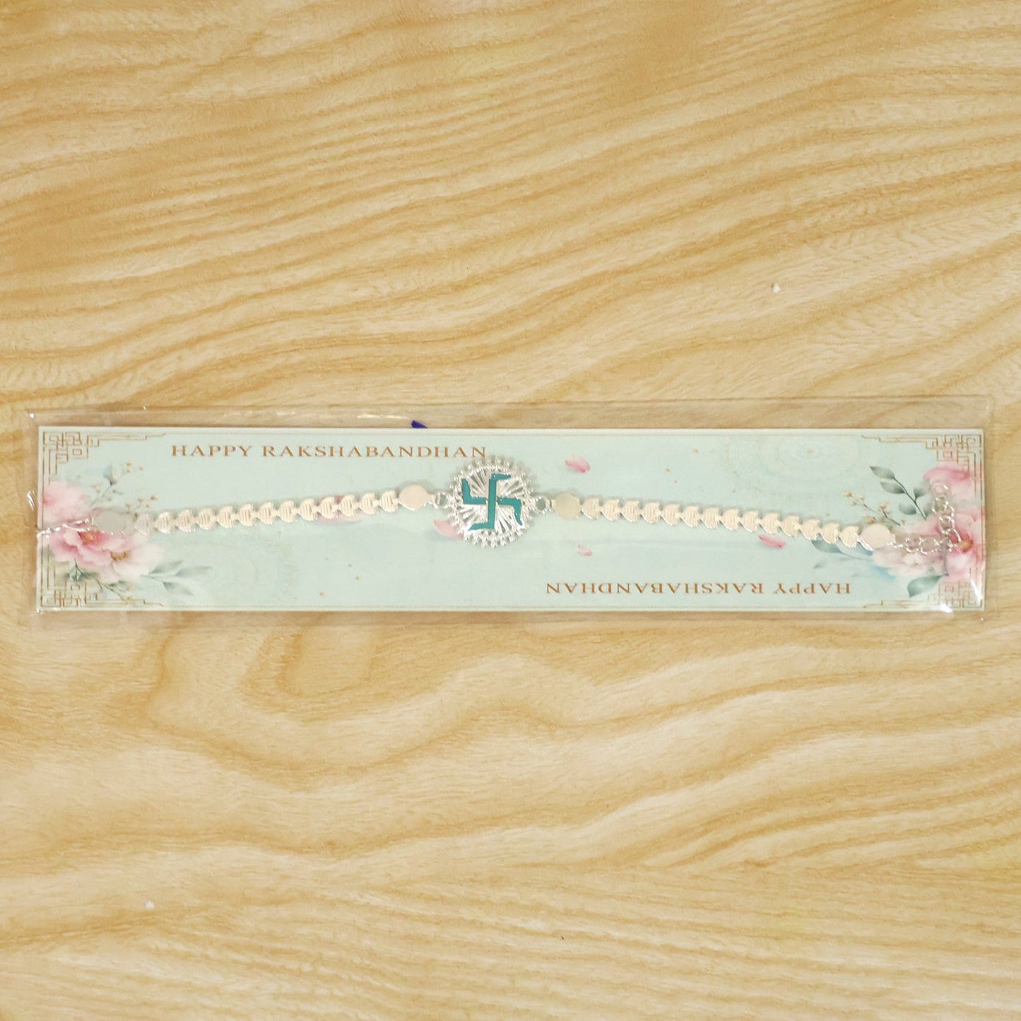 Round Silver Swastik Turquoise Enamel Studded Chain Rakhi