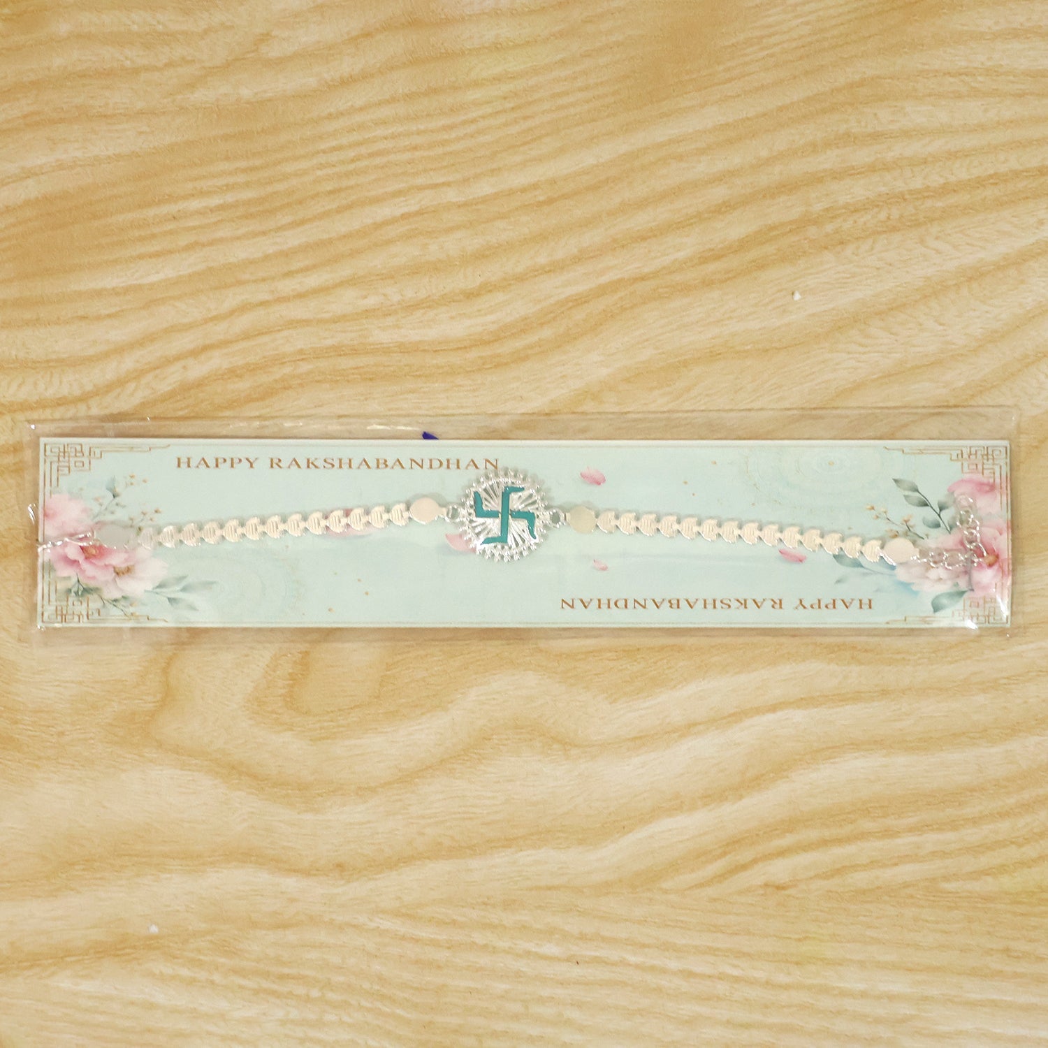 Round Silver Swastik Turquoise Enamel Studded Chain Rakhi