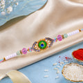 Peacock Feather Kundan Beaded Rakhi with Floral Center Charm Design