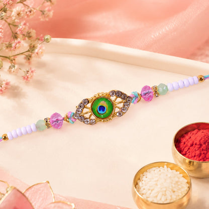 Peacock Feather Kundan Beaded Rakhi with Floral Center Charm Design