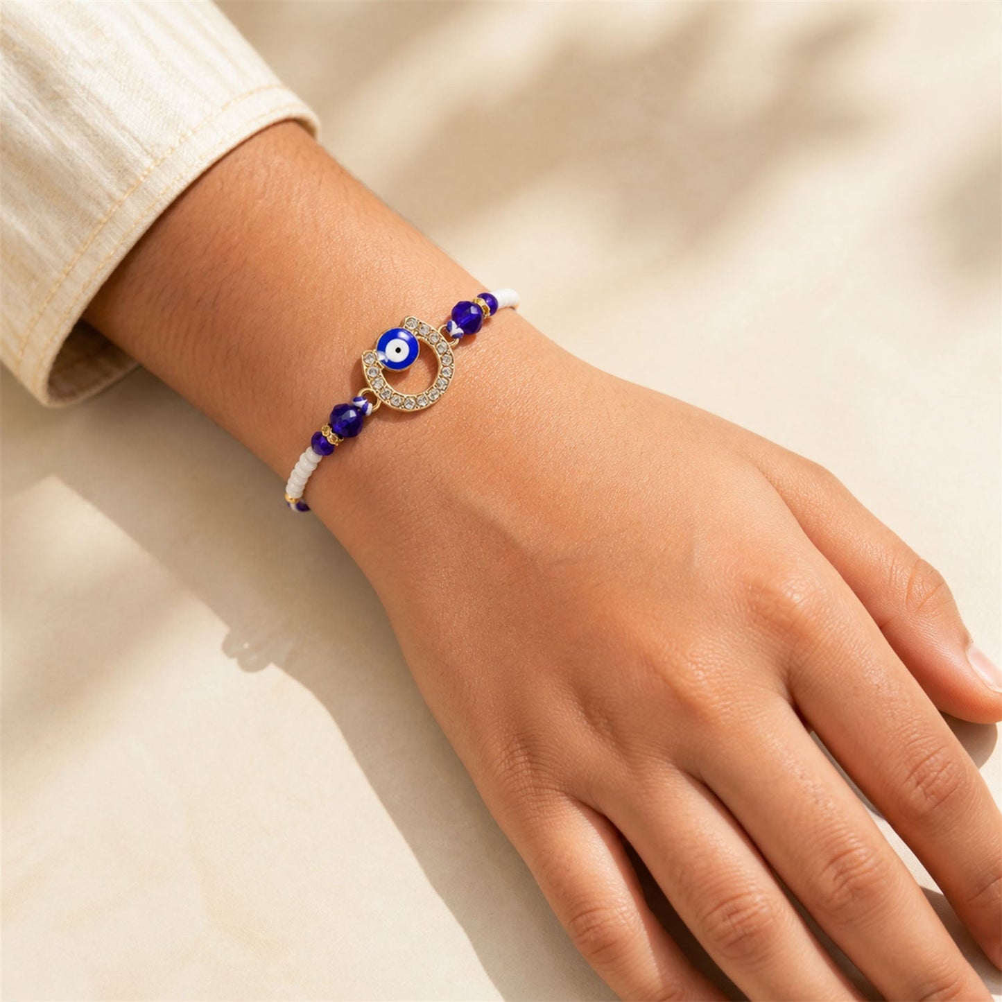 Crescent Evil Eye Beaded Rakhi with Crystal Ring Center Charm