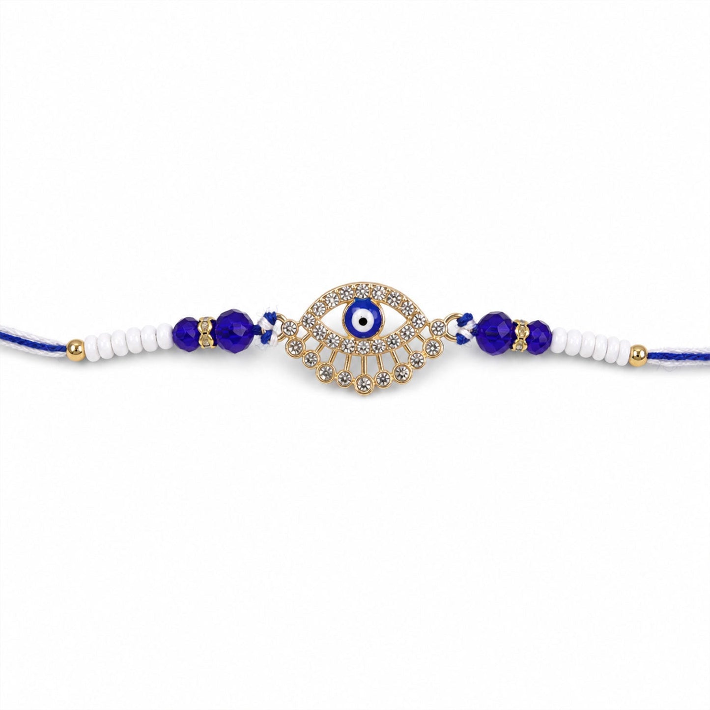 A gold and diamond evil eye Rakhi with blue and white beads on a plain white background.