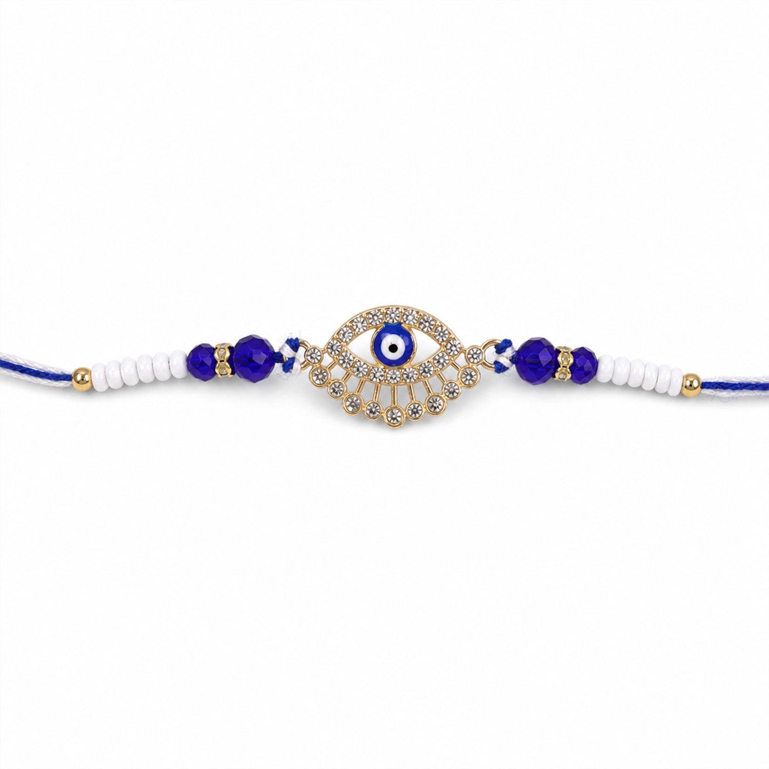 A gold and diamond evil eye Rakhi with blue and white beads on a plain white background.