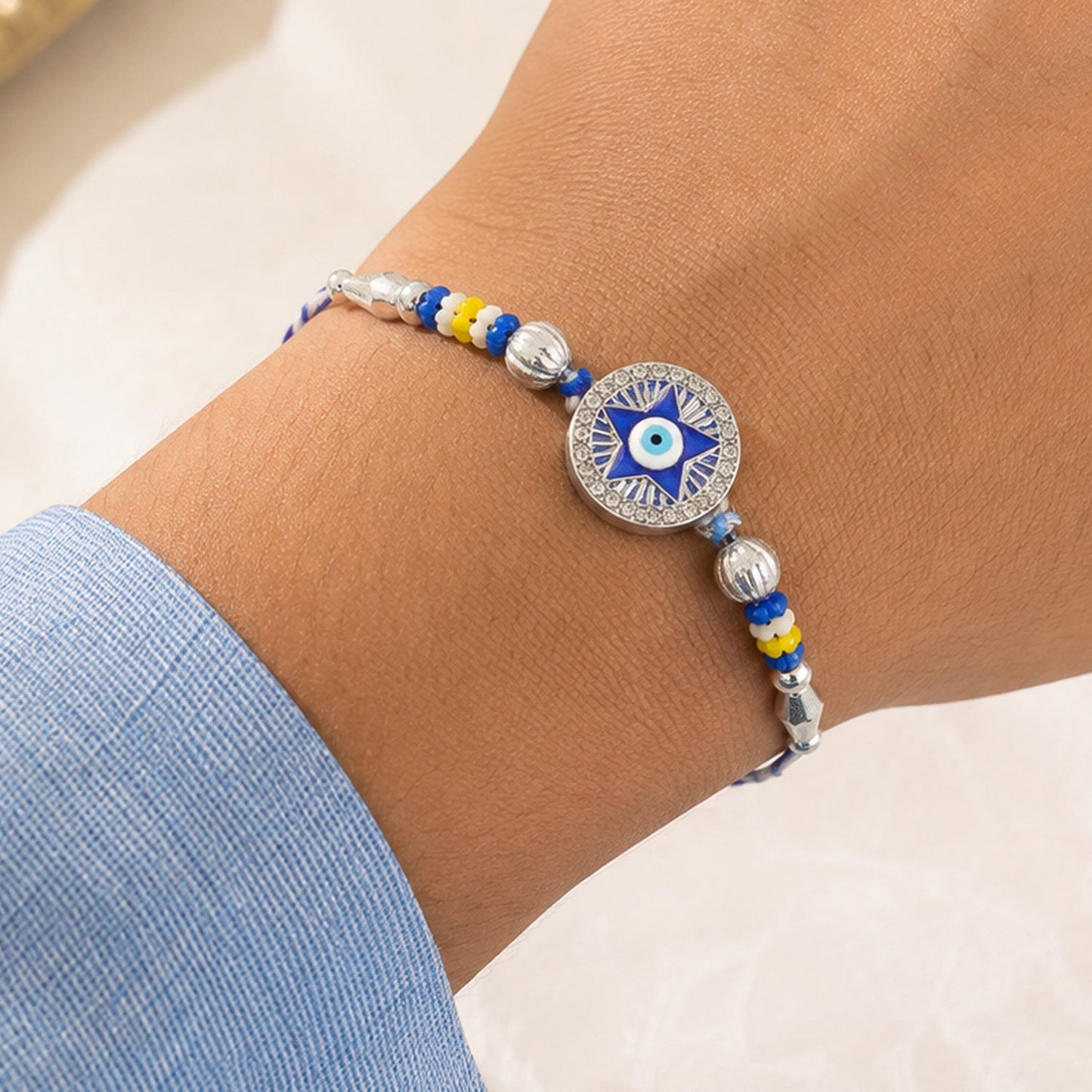 Star Design Evil Eye Beaded Rakhi with Round Stone Center Charm Design