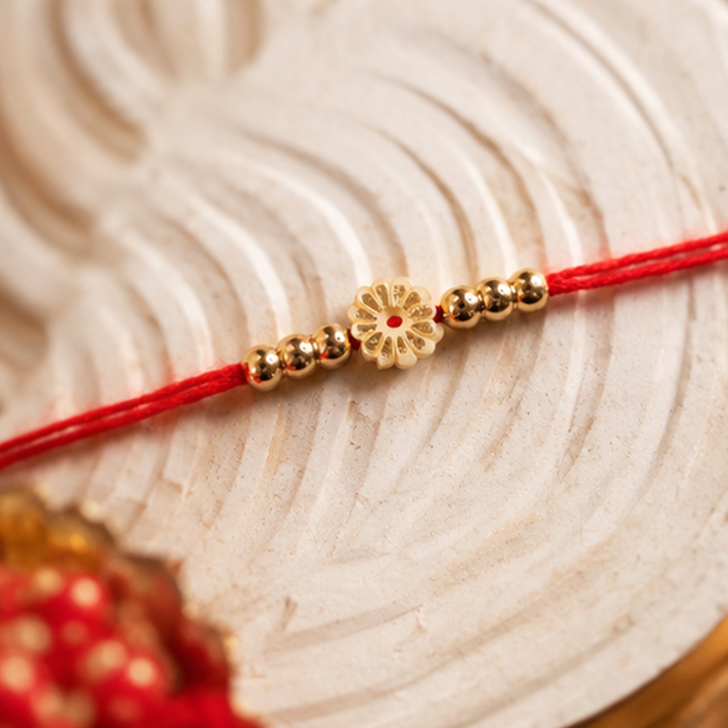 Traditional Floral Motif Golden Bead Minimalist Rakhi