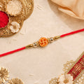 Religious Swastik Round Golden Bead Traditional Rakhi
