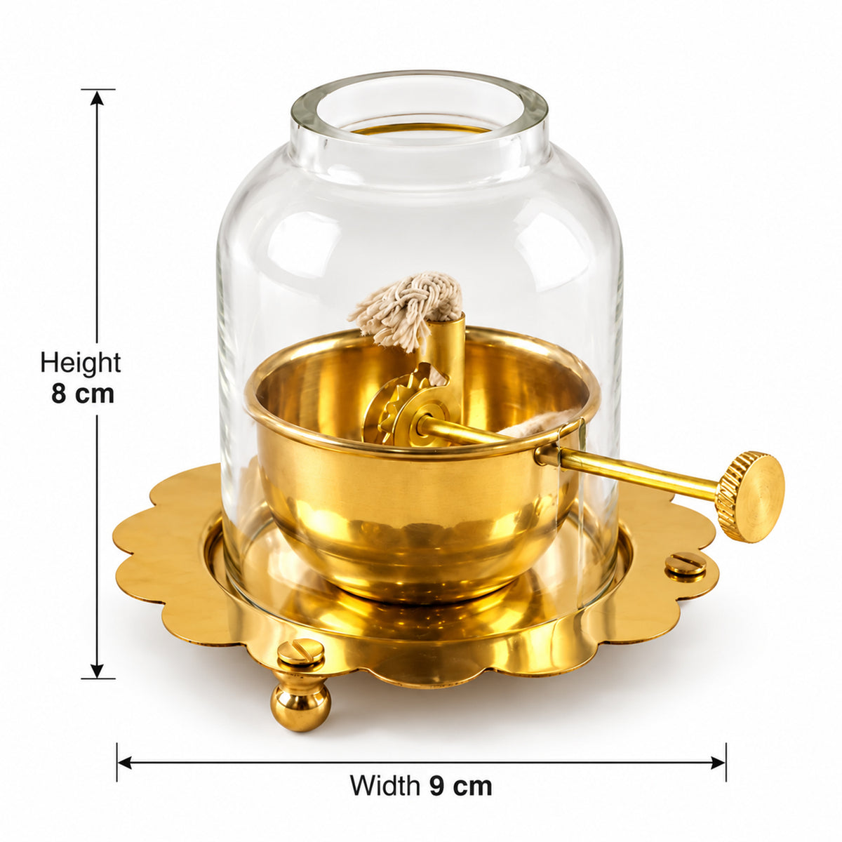 A brass oil lamp with a glass dome is displayed with measurements indicating 8 cm height and 9 cm width.