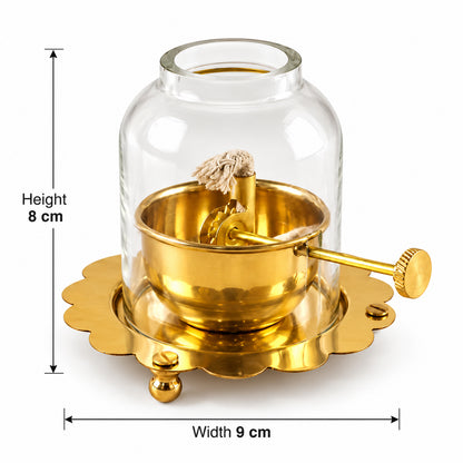 A brass oil lamp with a glass dome is displayed with measurements indicating 8 cm height and 9 cm width.