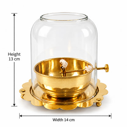 A brass oil lamp with a glass dome is shown with height and width dimensions of 13 cm and 14 cm.