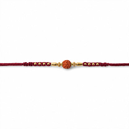 Red Braided Rakhi with a Rudraksha Bead and Wooden Bead Accents