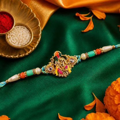 Lord Krishna Flute Pendant Rakhi with Pink and Yellow Drapery
