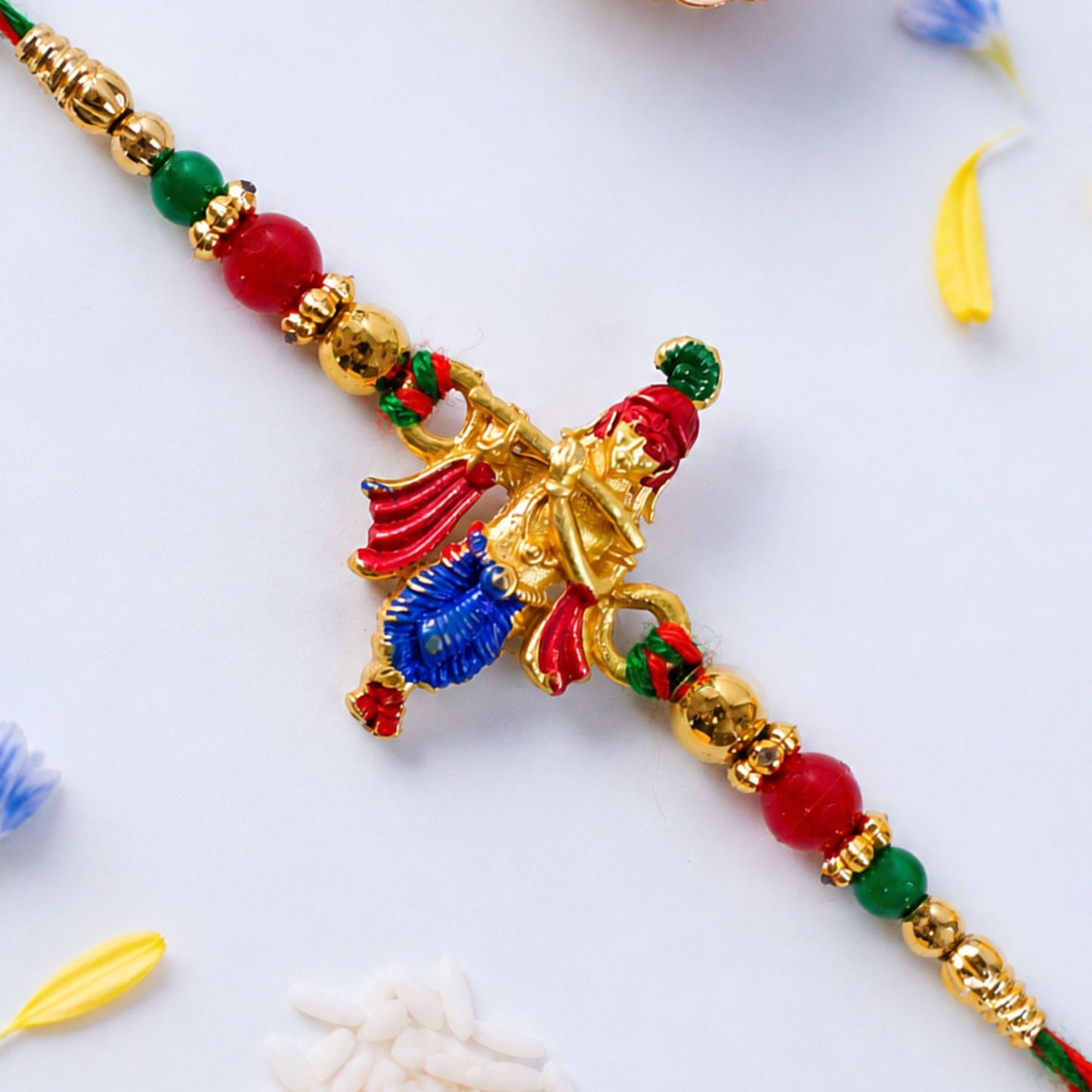 Lord Krishna Flute Pendant Rakhi with Red and Green Beads