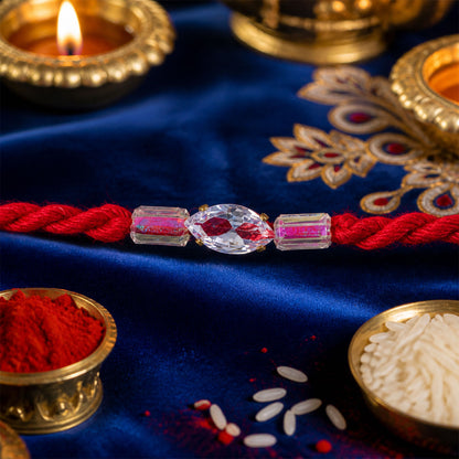 Red Thread Rakhi with Pink and Clear Crystal Bead Pendant Accents