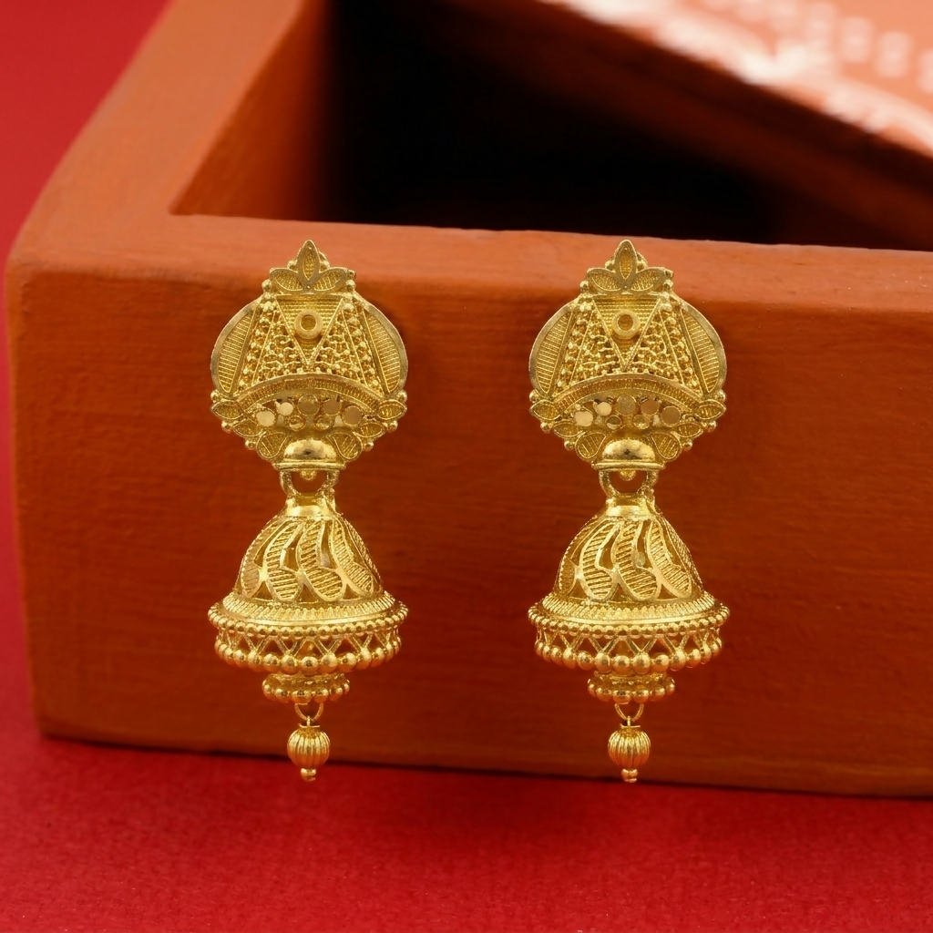 Pair of traditional gold tone jhumka earrings