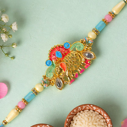 Textured Gold Elephant Pendant Rakhi with Multicolor Kundan