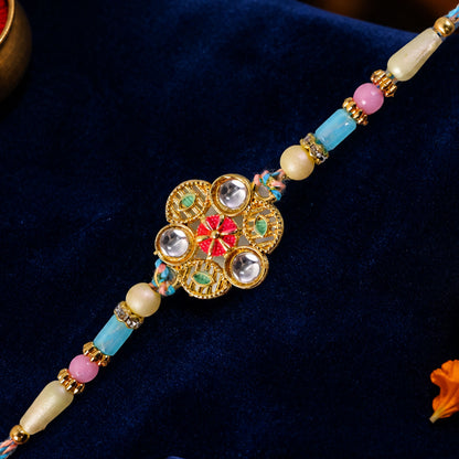 Blue Pink Floral Rakhi with Gold Medallion and Soft Festive Brother Gift Styling