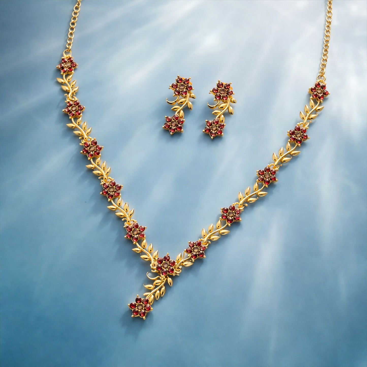 Everlasting Bloom V-Necklace with Ruby Floral Design and Elegant Gold Detailing