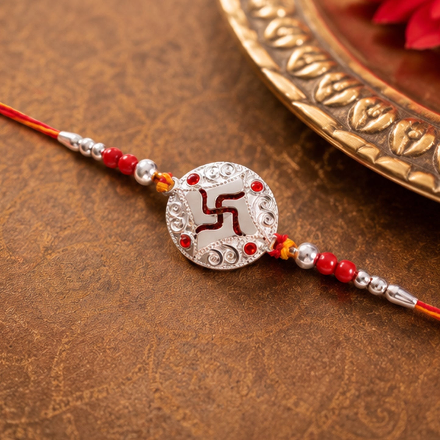 Silver Swastik Stone Rakhi with Red Thread and Handmade Look