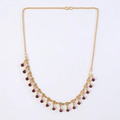 Red stone drop accents on gold plated leaf design necklace