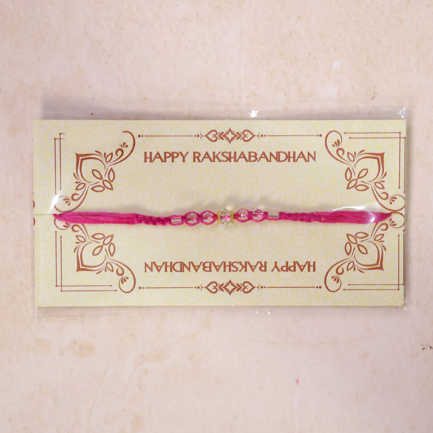 Pink Beaded Rakhi with Rose-Toned Sparkling Crystal Stones
